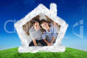 Composite image of overview of a man and his wife holding house