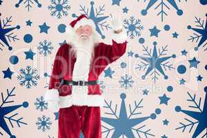 Composite image of jolly santa waving at camera