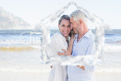 Composite image of happy couple hugging on the beach woman looki