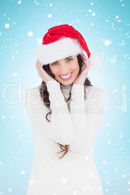 Composite image of festive brunette smiling at camera