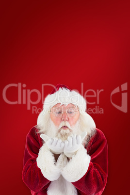 Composite image of santa claus blows something away