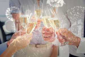 Composite image of hands toasting with champagne