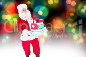 Composite image of father christmas holding many gifts