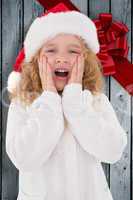 Composite image of festive little girl with hands on face