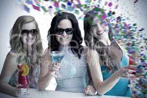 Composite image of friends drinking cocktails