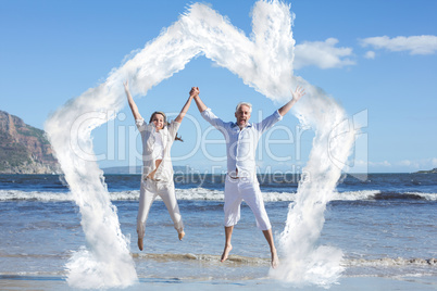 Composite image of happy couple jumping up barefoot on the beach