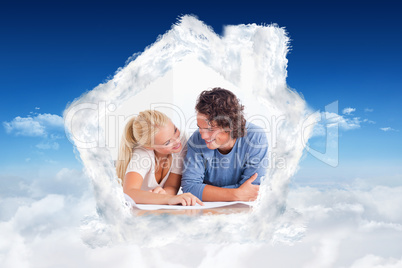 Composite image of smiling couple moving in a new house