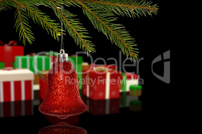 Composite image of red christmas decoration hanging from branch