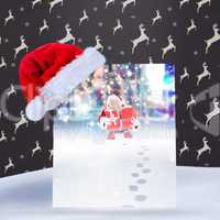 Composite image of santa hat on poster