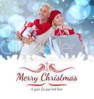 Composite image of happy festive couple with gifts and bags