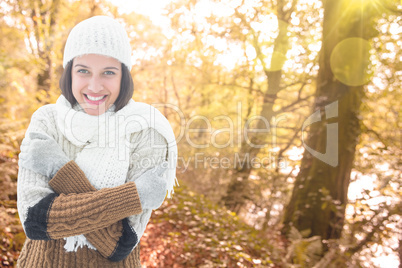 Composite image of brunette in warm clothing