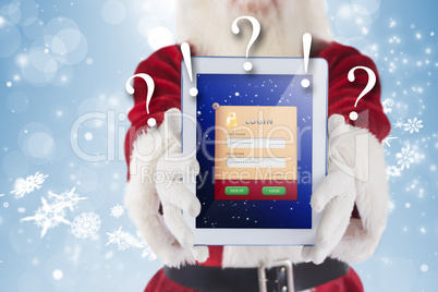 Composite image of santa presents a tablet pc