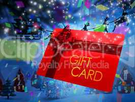 Composite image of santa flying his sleigh behind gift card