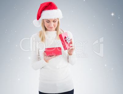 Festive blonde opening christmas gift