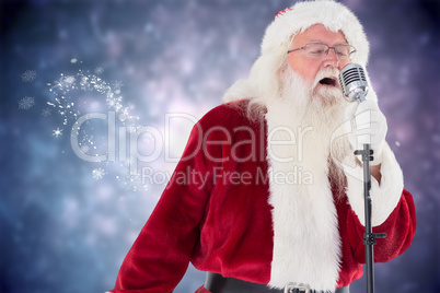 Composite image of santa claus is singing christmas songs