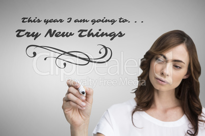 Composite image of concentrated businesswoman holding whiteboard