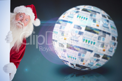 Composite image of santa looks out behind a wall