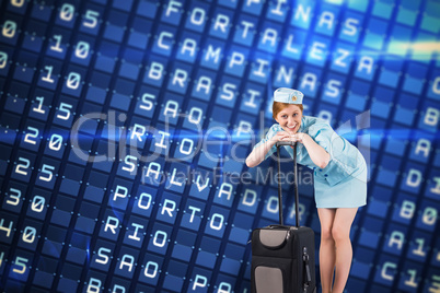 Composite image of pretty air hostess smiling at camera