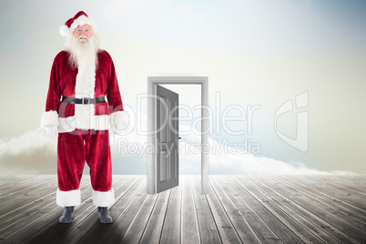 Composite image of jolly santa smiling at camera