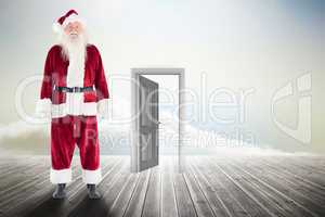 Composite image of jolly santa smiling at camera