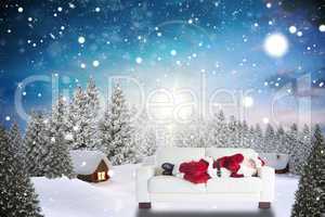 Composite image of father christmas sleeps on a couch