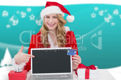 Composite image of woman with a credit card