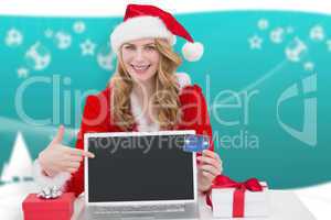 Composite image of woman with a credit card