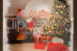 Composite image of santa claus winking