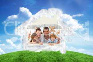 Composite image of happy family lying in bed and smiling at the