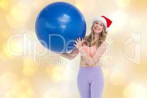 Composite image of smiling blonde woman holding exercise ball
