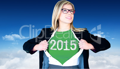 Composite image of businesswoman opening shirt in superhero styl