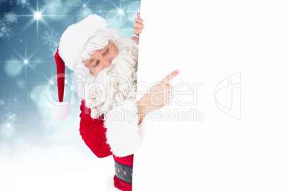 Composite image of festive father christmas presenting sign