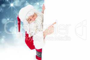 Composite image of festive father christmas presenting sign