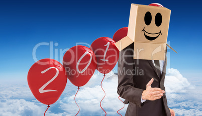 Composite image of anonymous businessman offering his hand