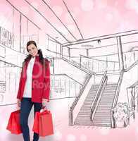 Composite image of happy brunette in winter clothes holding shop