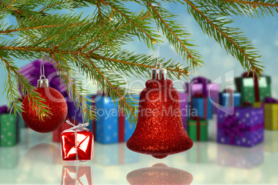 Composite image of red decorations on branch