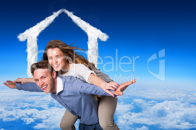 Composite image of smiling young man carrying woman