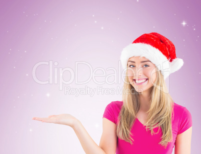 Festive blonde presenting with hand