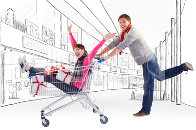 Composite image of man pushing woman in trolley