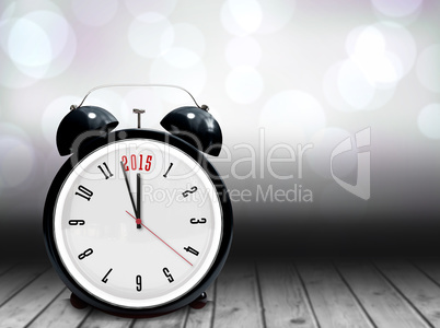 Composite image of 2015 in black alarm clock