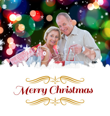 Composite image of couple with shopping bags