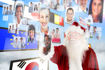 Composite image of santa claus pointing