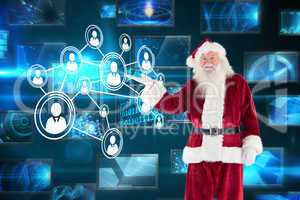 Composite image of santa shows something to camera