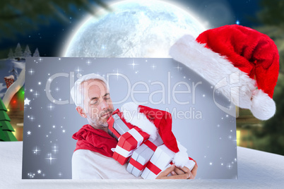 Composite image of happy festive man with gifts
