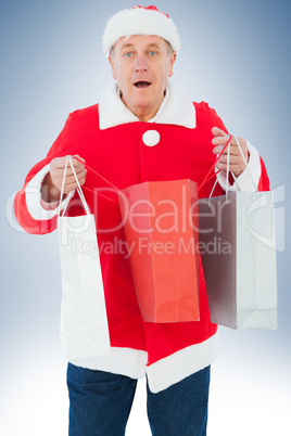 Festive man holding shopping bags
