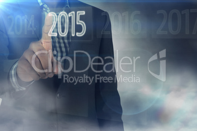 Composite image of focused businessman pointing