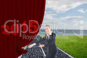 Composite image of businesswoman pulling a rope