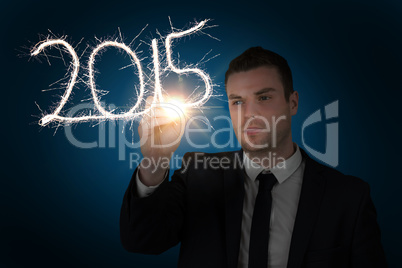 Composite image of businessman touching spark