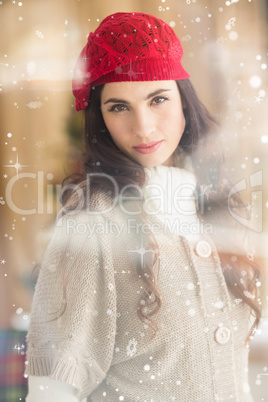 Composite image of portrait of a attractive brunette with red hat