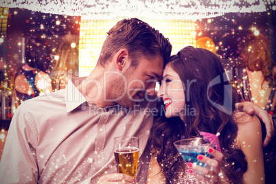 Composite image of cute couple drinking